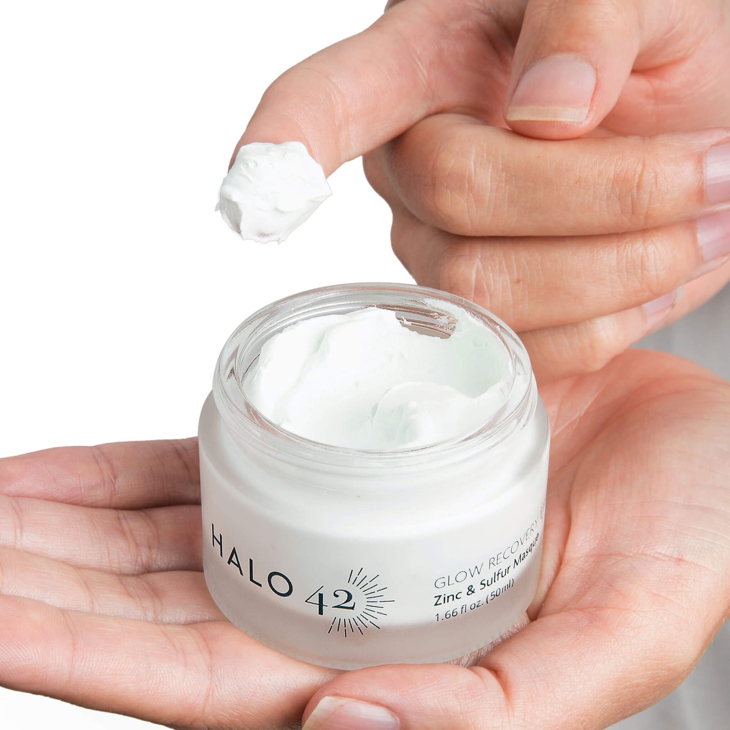 Halo42 Skincare Zinc and Sulfur mask showing finger dipping into product
