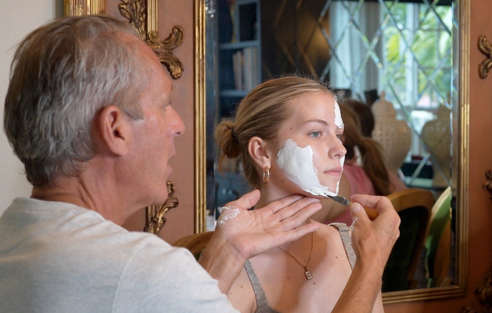 Tim Quinn Applying Halo42 skincare zinc and sulfur mask to young woman